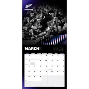 May include: A black and white calendar featuring a rugby match scene with players in action. The calendar displays the month of March 2026, with a schedule of days and dates. The All Blacks logo is at the top.