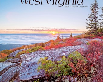 May include: A 2027 16-month calendar titled Wild & Scenic West Virginia. The cover features a landscape photograph of a rocky mountain ridge with red and green foliage, overlooking a sea of clouds at sunrise under a pale blue sky.