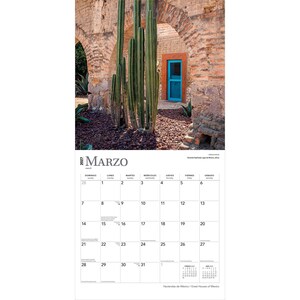 May include: A 2027 wall calendar page for March featuring a photograph of tall green cacti in front of a rustic stone archway with a bright blue door. The calendar grid displays the days of the month with the text Marzo and Hacienda San Crist&oacute;bal.