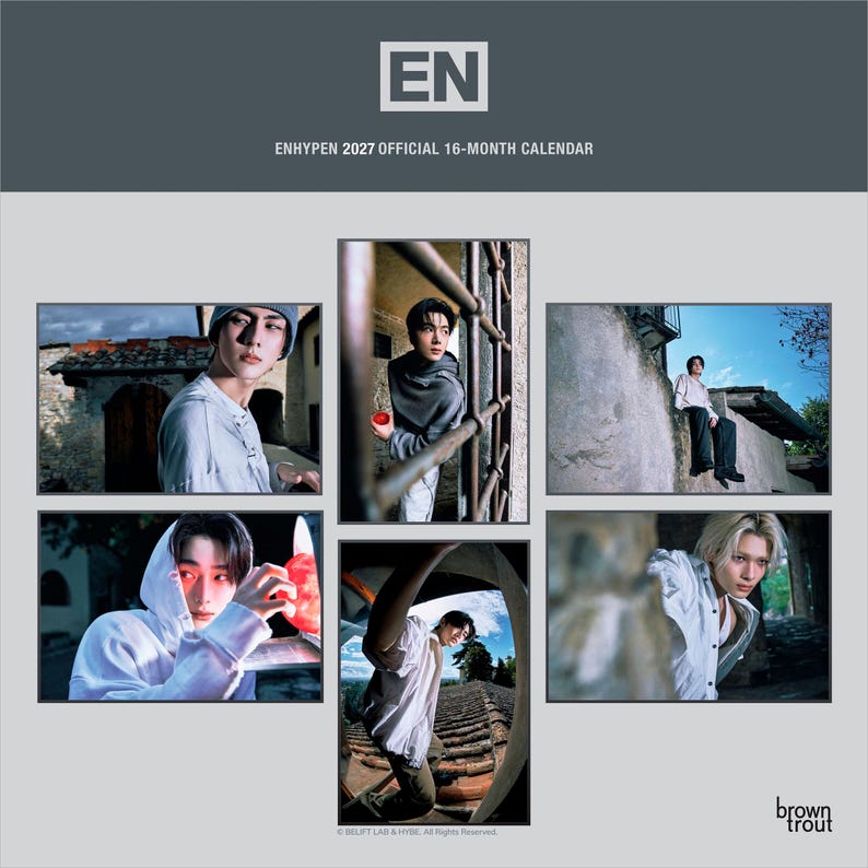 May include: The ENHYPEN 2027 official 16-month calendar features a dark gray header with the EN logo and text. Below, five distinct photographic panels display various portraits of the group members in outdoor settings with stone architecture.