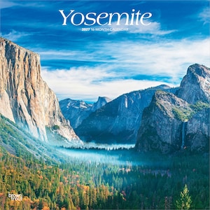 May include: A 2027 16-month calendar featuring a landscape photograph of Yosemite National Park. The image displays towering granite cliffs, a dense evergreen forest, and a waterfall under a bright blue sky with white clouds. Text reads Yosemite.