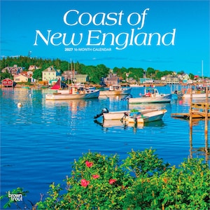 May include: A 2027 16-month calendar titled Coast of New England featuring a vibrant coastal harbour scene with multiple white boats floating on deep blue water, colourful houses along the shoreline, and bright pink flowers in the foreground.