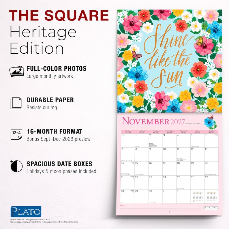 May include: A 16-month wall calendar titled The Square Heritage Edition. The top page features a light blue background with colorful flowers and butterflies surrounding the gold text Shine like the sun. The bottom page shows November 2027.