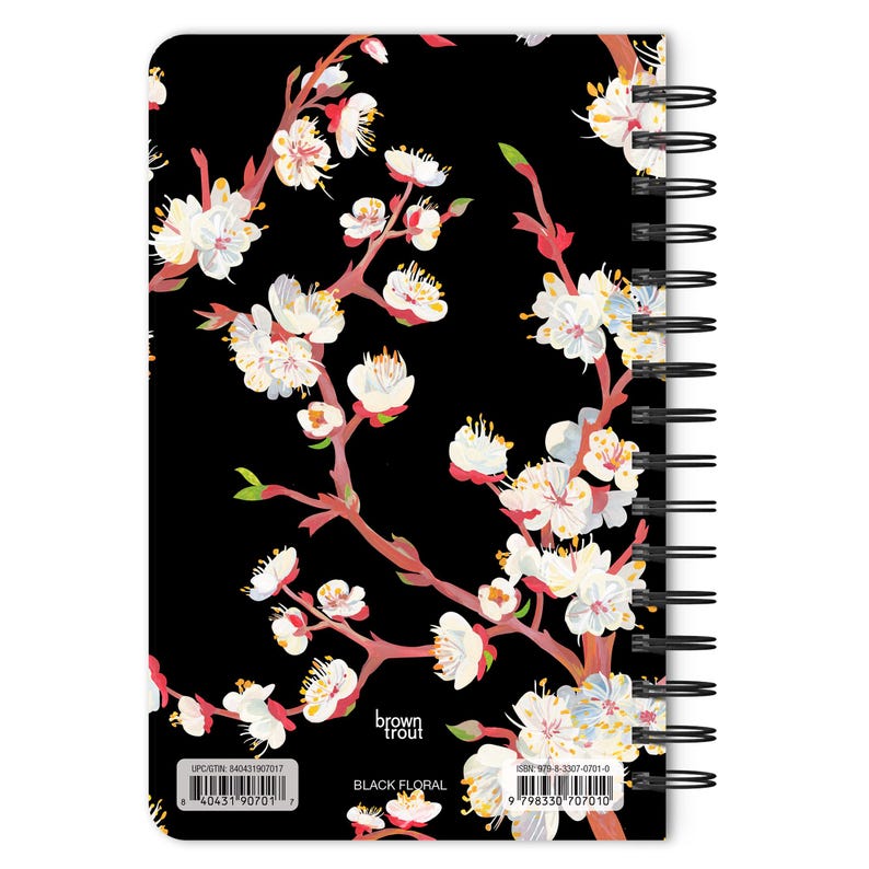 May include: Black floral design on a spiral bound notebook with a black background. The notebook cover features a floral pattern with pink and white flowers. The text "brown trout" and "BLACK FLORAL" are printed on the cover.