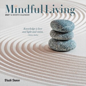 May include: A 2027 16-month calendar titled Mindful Living featuring a stack of three grey speckled stones on a raked sand background. The text reads Knowledge is love and light and vision by Helen Keller and the brand name Brush Dance.