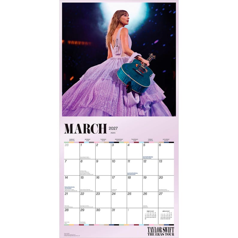 May include: A wall calendar page for March 2027 featuring a photograph of a performer in a layered lavender gown holding a teal acoustic guitar. The calendar grid displays the days of the month with the text Taylor Swift The Eras Tour at the bottom.