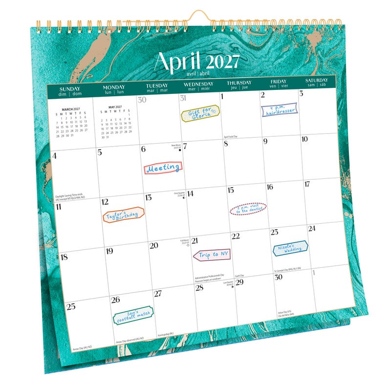 May include: A wall calendar for April 2027 with a teal and gold marble design. The calendar has handwritten notes for appointments and events. The top of the calendar reads "April 2027".