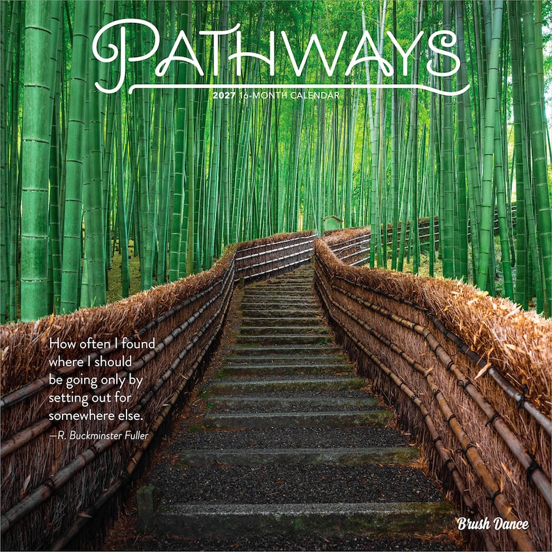 May include: A 2027 16-month calendar titled PATHWAYS featuring a photograph of a stone staircase winding through a dense green bamboo forest, flanked by textured brown thatched fences, with a quote by R. Buckminster Fuller and Brush Dance text.