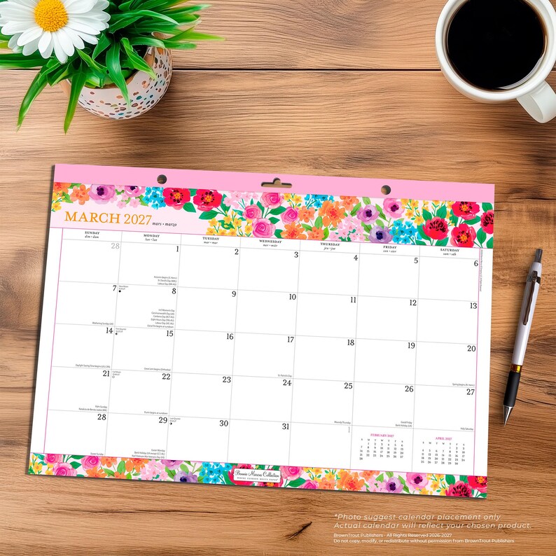May include: A March 2027 wall calendar featuring a vibrant floral border with pink, red, orange, and blue flowers at the top and bottom. The calendar grid displays dates from the 1st to the 31st, with small February and April 2027 calendars included.
