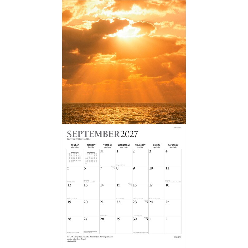May include: A wall calendar for September 2027 featuring a photograph of a golden sunset over the ocean with sunbeams breaking through clouds. The calendar grid displays the month, days of the week, and dates, with Psalm 113:3 printed at the bottom.
