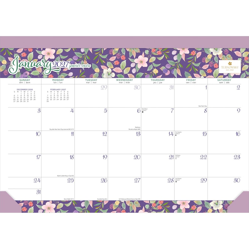 May include: A desk calendar for January 2027 featuring a purple floral border with pink flowers and green leaves. The grid displays days of the week, dates, and small monthly calendars for December 2026 and February 2027. The Turnowsky logo is visible.
