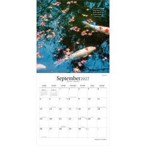 May include: A September 2027 wall calendar featuring a photograph of koi fish swimming in dark water scattered with red maple leaves. The text reads: Everyone must take time to sit and watch the leaves turn. - Elizabeth Lawrence. September 2027.