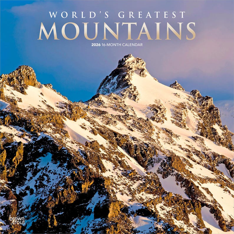 May include: A 2026 16-month calendar titled "World's Greatest Mountains." The cover features a stunning photograph of snow-covered mountain peaks under a blue sky. The mountains are brown and white.
