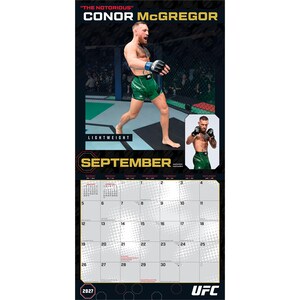 May include: A 2027 wall calendar featuring Conor McGregor for the month of September. The top section displays a large photo of the fighter in green shorts and black gloves inside an octagon, with a smaller inset photo and the text SEPTEMBER.
