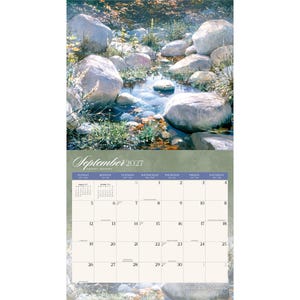 May include: A wall calendar for September 2027 featuring a nature photograph of a clear stream flowing between large, smooth grey rocks and green vegetation. The calendar grid displays the days of the month with a soft green background.