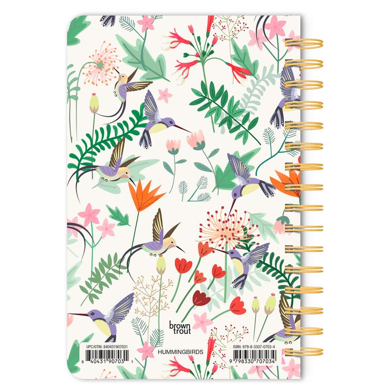 May include: A white spiral bound notebook with a colorful hummingbird and floral pattern. The cover features the text "brown trout" and "HUMMINGBIRDS".