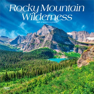 May include: A 2027 16-month calendar titled Rocky Mountain Wilderness featuring a landscape photograph of a large, jagged mountain peak with patches of snow, a dense green pine forest, and a bright turquoise lake under a clear blue sky.