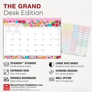 May include: A September 2027 desk calendar featuring a floral border with pink, red, and blue flowers. The calendar includes a grid for dates, a sheet of colorful rectangular stickers, and text detailing features like large date boxes and a durable backboard.