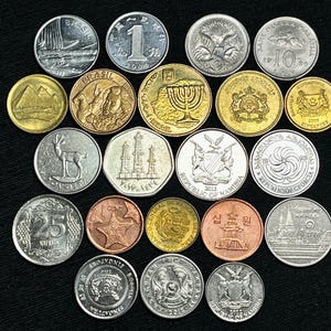 May include: A collection of various international coins, including Brazilian, Israeli, and Singaporean currency, arranged on a black surface. The coins display diverse designs, such as buildings, animals, and text, showcasing a range of colors and metallic finishes.