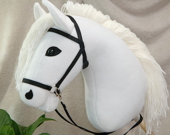 Hobby horse with horse halter and reins