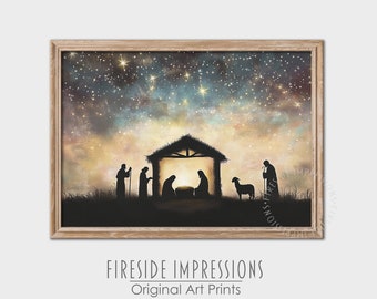 May include: A framed art print depicting a Nativity scene under a starry night sky. Silhouetted figures of the Holy Family, shepherds, and a sheep are in front of a stable. The print has the text "Fireside Impressions Original Art Prints".