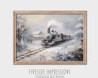 May include: A framed art print depicts a vintage steam train traveling through a snowy landscape. The black and silver train is the focal point, with smoke billowing from its stack. The artwork is set in a winter scene with a light brown wooden frame. The text "Fireside Impressions Original Art Prints" is at the bottom.