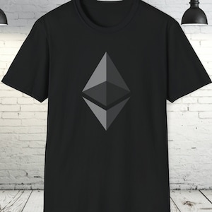 May include: Black t-shirt with a grey Ethereum cryptocurrency logo printed on the front.