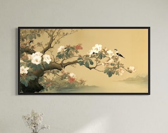 May include: A rectangular wall art print in a black frame featuring a horizontal landscape painting of a flowering tree branch with white blossoms and two small birds, set against a soft golden background with distant mountains and water.