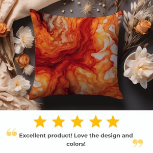 a pillow with a red and orange swirl on it