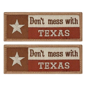 May include: Two brown and beige embroidered patches with the text "Don't mess with TEXAS" in white. The patches feature a white star on a brown background and a red and white stripe.