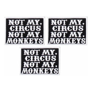 May include: Three black iron-on patches with white embroidery. Each patch reads "Not My Circus Not My Monkeys".