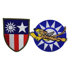 May include: Two embroidered patches, one with a shield design featuring the flag of the Republic of China and the other with a blue circle with a white star and a flying tiger.