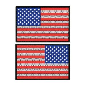 May include: Two black-bordered patches with an American flag design. The flag is red, white, and blue with a honeycomb pattern.