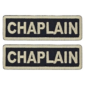 May include: Two black embroidered patches with white stitching. The patches are rectangular and have the word "CHAPLAIN" written on them.