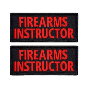 May include: Two black embroidered patches with red lettering that reads "FIREARMS INSTRUCTOR".
