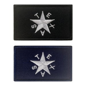May include: Two embroidered patches featuring the Texas state flag. The patches are both rectangular and have a white star with the letters "TEXAS" surrounding it. One patch is black with white embroidery, and the other is navy blue with white embroidery.