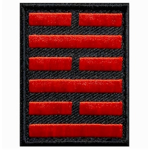 May include: A black patch with a red five-barred gate symbol. The symbol is a traditional Chinese symbol representing good fortune and prosperity.
