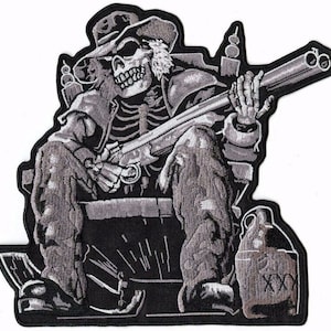 May include: Embroidered patch featuring a skeleton cowboy with a shotgun, wearing a hat and seated. The design is in shades of gray and black, with detailed stitching. A jug with "XXX" is visible. The patch has a black border.