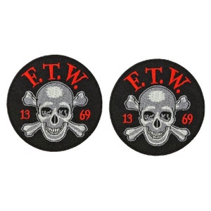 May include: Two black and white embroidered patches with a skull and crossbones design. The patches are circular and feature the text "E.T.W." in red lettering. The numbers "13" and "69" are also embroidered in red on the patches.
