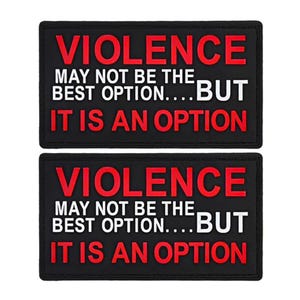May include: Two black patches with white text that reads "VIOLENCE MAY NOT BE THE BEST OPTION... BUT IT IS AN OPTION". The text "VIOLENCE" is in red.