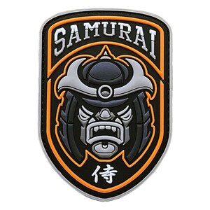 May include: A black and orange embroidered patch with a samurai warrior's face in the center. The patch has the word "SAMURAI" in white lettering at the top and the Japanese character for "wait" at the bottom.