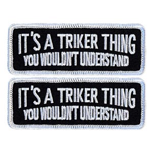 May include: Two black embroidered patches with white stitching. The patches read "It's a Triker Thing You Wouldn't Understand."