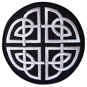 May include: A black and white embroidered patch featuring a Celtic knot design. The knot is a traditional symbol of eternity and interconnectedness.