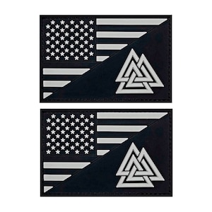 May include: Two black and white patches with an American flag on the top half and a white Valknut symbol on the bottom half.