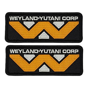May include: Two black embroidered patches with the text "Weyland-Yutani Corp" in white and a stylized white and orange "W" logo.