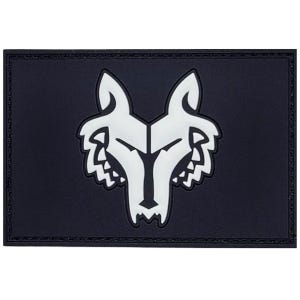 May include: A rectangular patch featuring a white wolf head design on a black background. The wolf's head is stylized with sharp angles and a detailed outline. The patch has a textured border.
