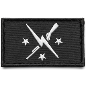 May include: Black rectangular patch with white embroidered design. The design features a lightning bolt, crossed rifles, and three five-pointed stars. The patch has a black border.