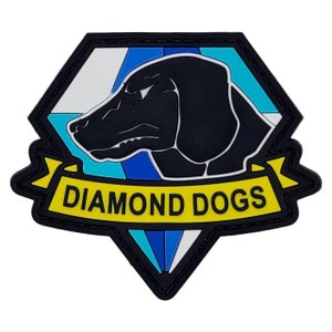 May include: A black and yellow patch with a diamond shape. The diamond has a white and blue background with a black silhouette of a dog's head. The text "DIAMOND DOGS" is written on a yellow banner.
