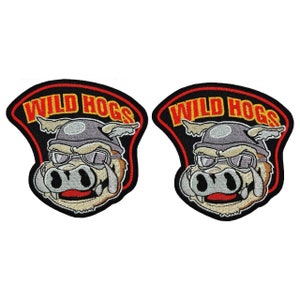 May include: Two black embroidered patches with a cartoon pig wearing a helmet and goggles. The text "WILD HOGS" is written in yellow and red around the pig.