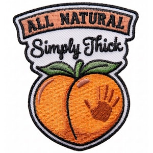 May include: An embroidered patch featuring an orange peach graphic with a brown handprint on the right side. Above the peach, the text reads ALL NATURAL in black letters on a tan background, followed by the black script text Simply Thick.